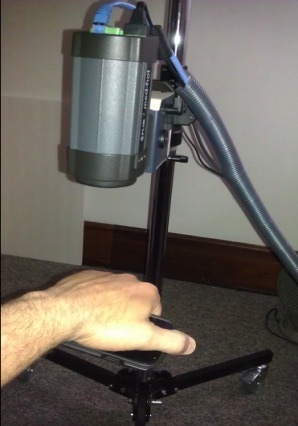 FLIR A320 thermal imaging camera mounted on a tripod over a hand holding a phone for the dorsal hand test